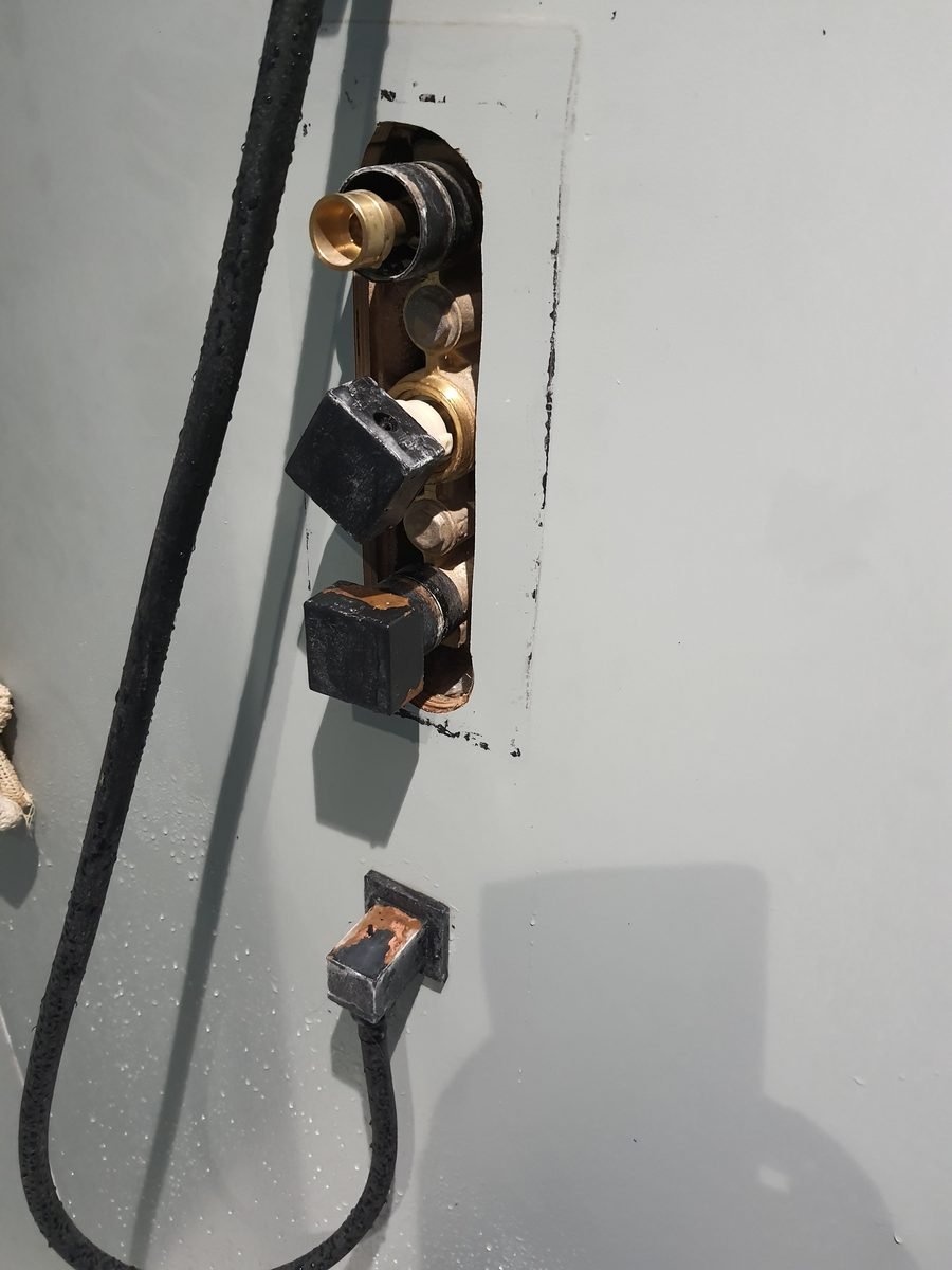 Concealed shower valve set into the wall